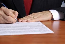 social security disability lawyer in st louis signing legal paperwork
