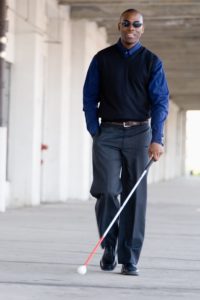 St Louis Long Term Disability Lawyer Blind man walking down sidewalk