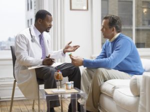 Doctor Discussing Medicine in His Clinic With a Patient St Louis Social Security Disability Attorney